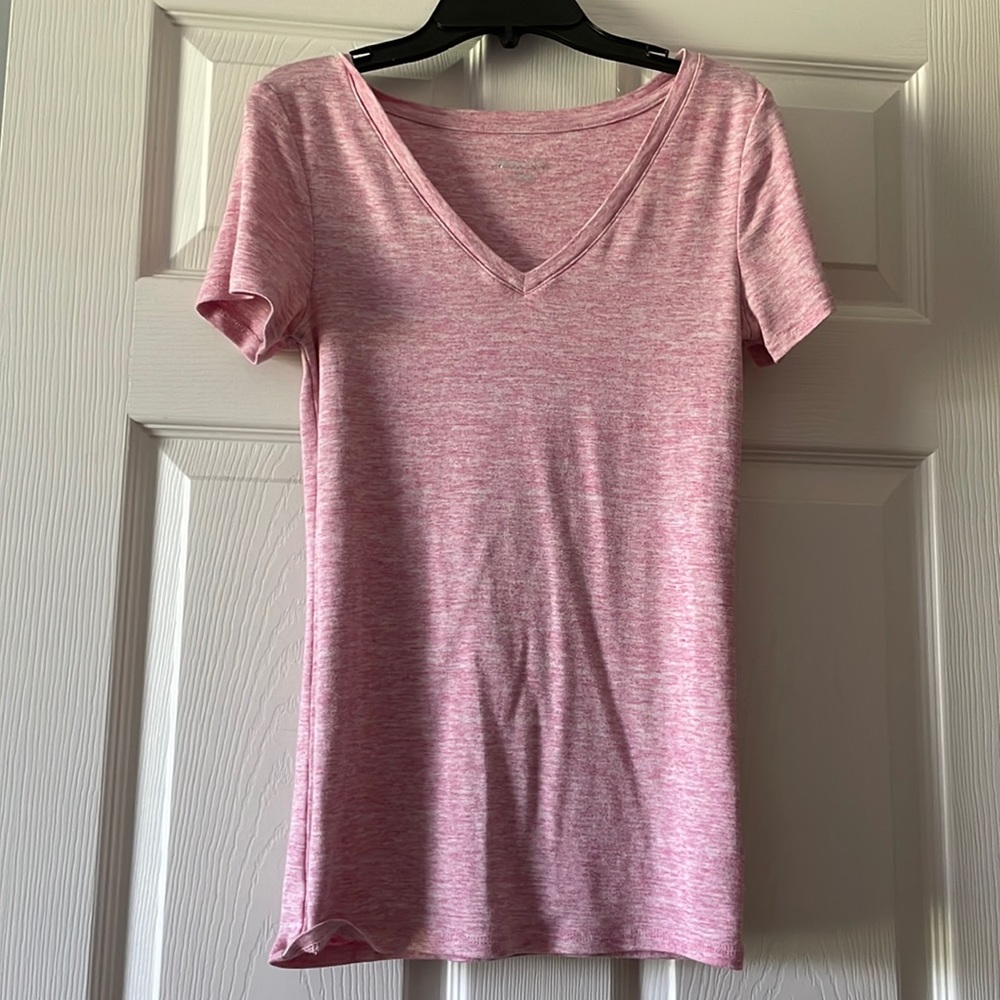 A light pinkish color t shirt v neck